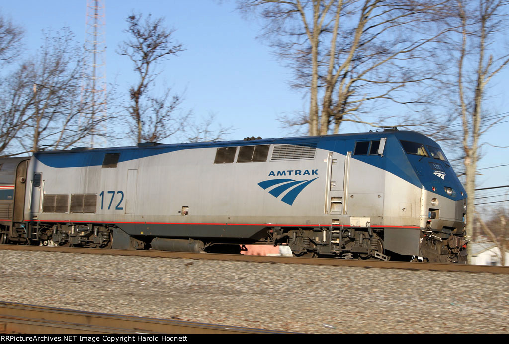 AMTK 172 leads train 80 towards the station at Elm